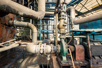 Fototapeta na wymiar old industrial pipeline equipment in a abandoned steel mills