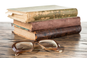 Vintage eyeglasses and old books