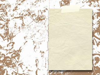 Close-up of one vintage paper sheet with tape on brown ink splotchy background