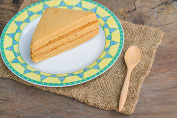 Sweet and tasty Coffee flavoured cake in dish and wooden spoon. 
great for during coffee break.