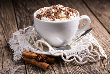 Cup of hot cappuccino with cinnamon for breakfast.