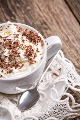 Cup of hot cappuccino with cinnamon for breakfast.