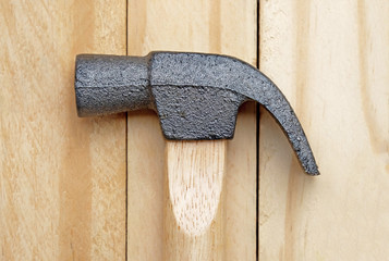 Hammer head and nail claw on side view of stainless steel hammer