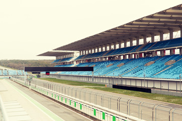 empty speedway and bleachers on stadium