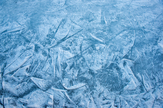 Blue ice in skate scratches background