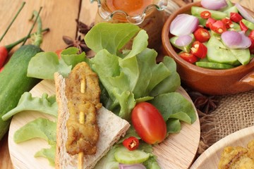 Pork satay,grilled pork with peanut sauce .