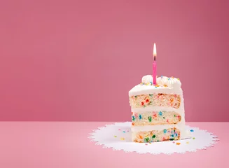 Slice of Birthday Cake with Candle on Pink © jfunk