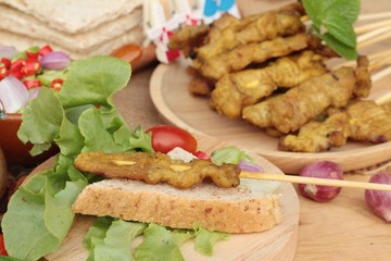 Pork satay,grilled pork with peanut sauce .