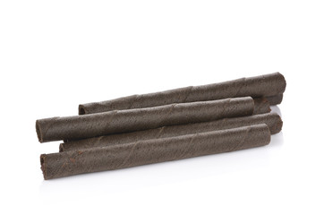 waffle rolls with chocolate cream on white background