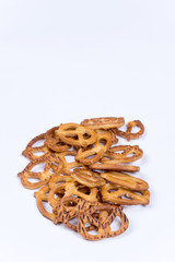 A bunch of pretzels on a white surface