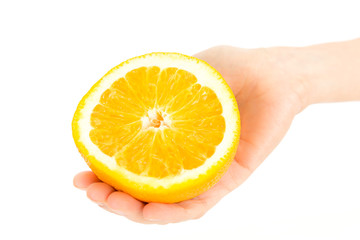 Orange half in woman's hand