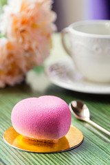 French mousse cake in pink chocolate velour