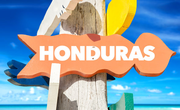Honduras welcome sign with beach background