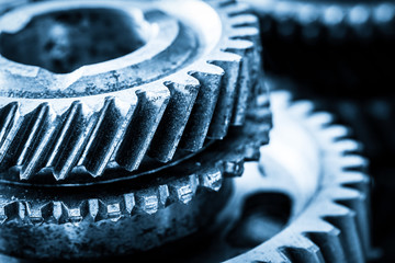 Gears, grunge cogwheels, real engine elements close-up. Heavy industry