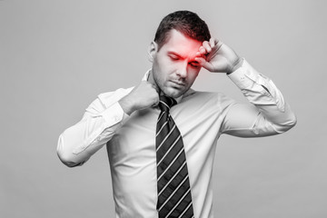 Handsome stylish businessman on grey background