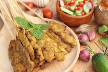 Pork satay,grilled pork with peanut sauce .