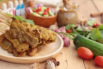 Pork satay,grilled pork with peanut sauce .