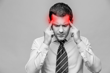 Handsome stylish businessman on grey background
