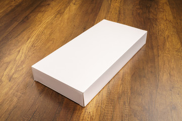 Blank white box mock up on wood background