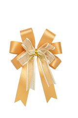 Shiny gold bow ribbon on white background