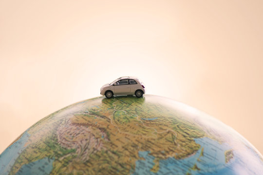 Miniature car traveling the world - Powered by Adobe