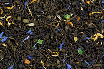 Mix green tea with cornflower petals, marigold, candied fruit, a