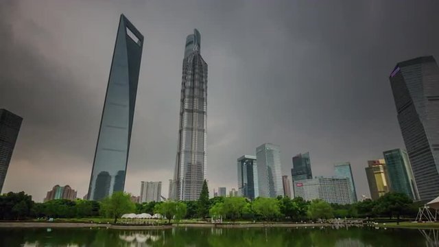 storm sky famous shanghai downtown buildings park pond panorama 4k time lapse china
