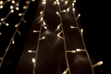 Christmas light chain along the way in the dark