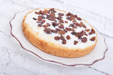 Baked chocolate muffins cakes on a plate on white