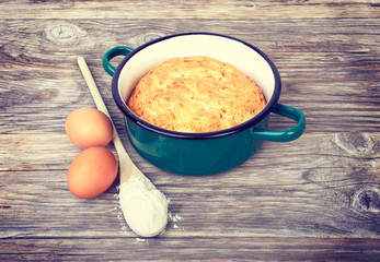 Biscuit, cake in shape for baking, saucepan