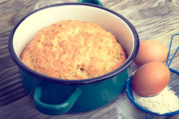 Biscuit, cake in shape for baking, saucepan