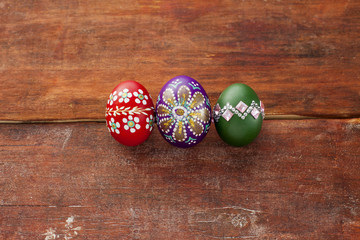 Colorful easter eggs on wooden board