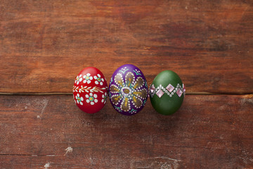 Colorful easter eggs on wooden board
