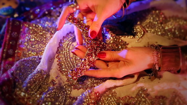 Golden  Oriental Jewelry and Accessories: Female Hands with beautiful National Indian Jewellery, Eastern Arabian Fairy Tale (Harem), Wedding Luxury Fashion and Beauty. Eastern Treasure by Candlelight.