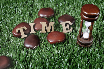 Sand-glass and wooden alphabet, Time management concept and in time idea