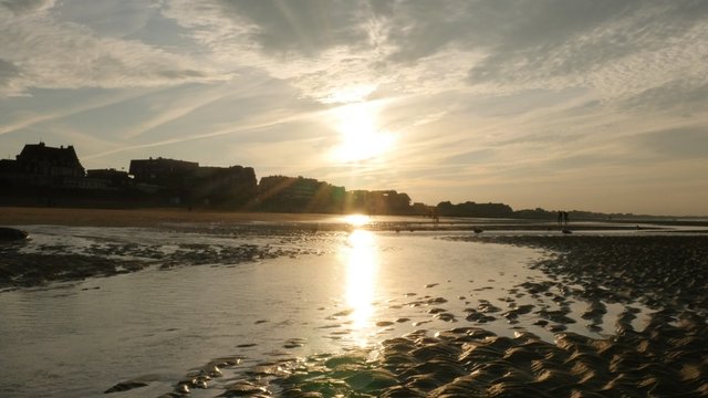 French city of Cabourg on the Le Mans channel beautiful sunset 4K 2160p 30fps UltraHD footage - Sunlight over beach on northern France Normandy style buildings 4K 3840X2160 UHD video 