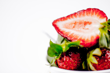 Half of strawberry isolated on white background