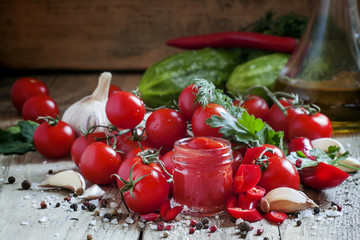 Tomato ketchup hot sauce with chili pepper and cherry tomatoes i