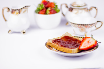 sweet strawberries jam on toast close up