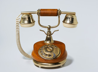 Old retro telephone on white background