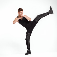 man kicking foot forward