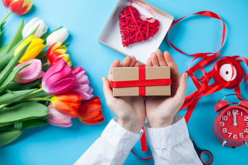 Female hands are holding a gift