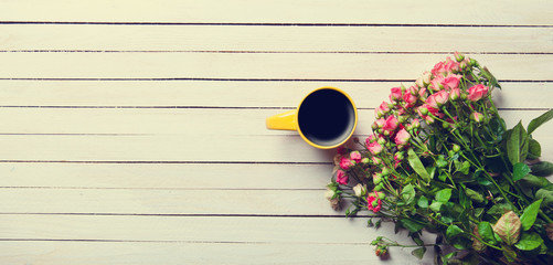  bouquet of roses and cup of coffee