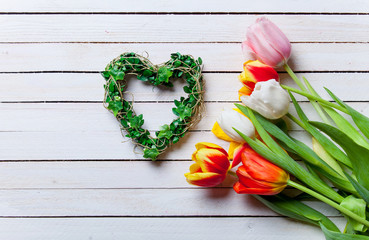 bouquet of tulips and heart shape gift