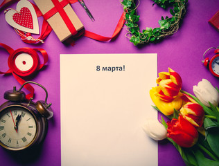 tulips and paper with words 8 March