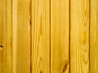 the background of new wood lacquered pine boards