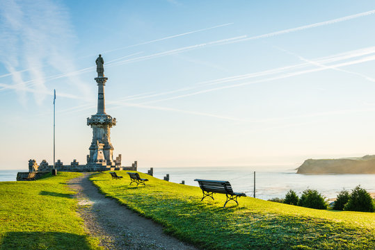Comillas marquis monument facing the Cantabric sea and blue sky. Comillas, province of Santander, Spain