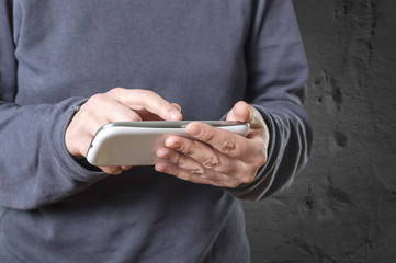 Hands holding smartphone