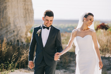 Young wedding couple walking