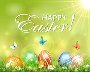 Easter background with eggs in grass with flowers
